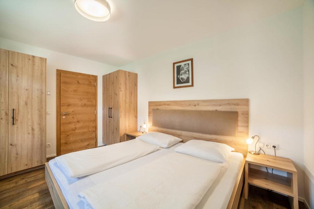 Postel nebo postele na pokoji v ubytování Parigger Apt Lavendel