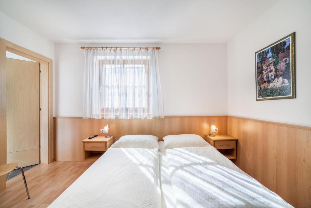 Postel nebo postele na pokoji v ubytování Parigger Apt Zirbe