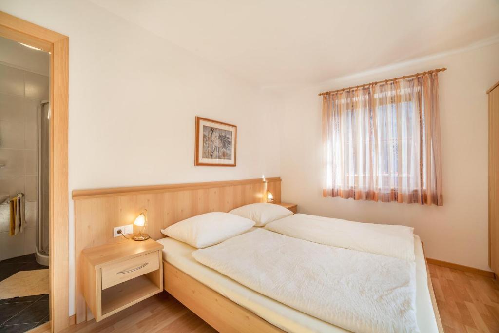 Postel nebo postele na pokoji v ubytování Parigger Apt Zirbe