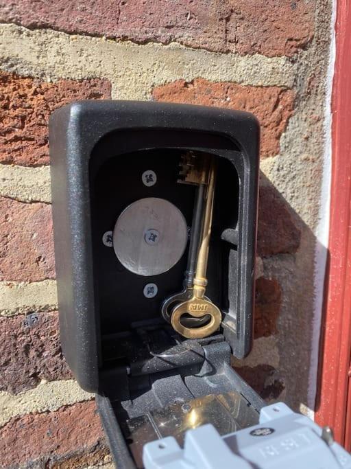 a metal object is attached to a brick wall at Studio centre village Soligny la Trappe proche Mortagne au perche in Soligny-la-Trappe