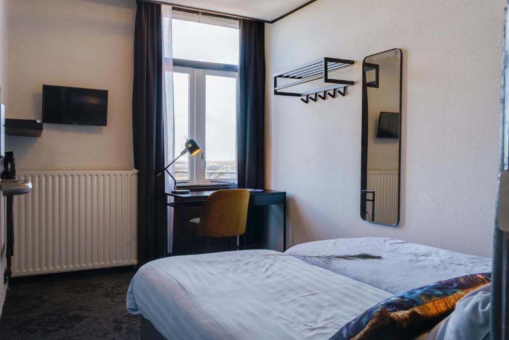 Postel nebo postele na pokoji v ubytování Hotel Pauw