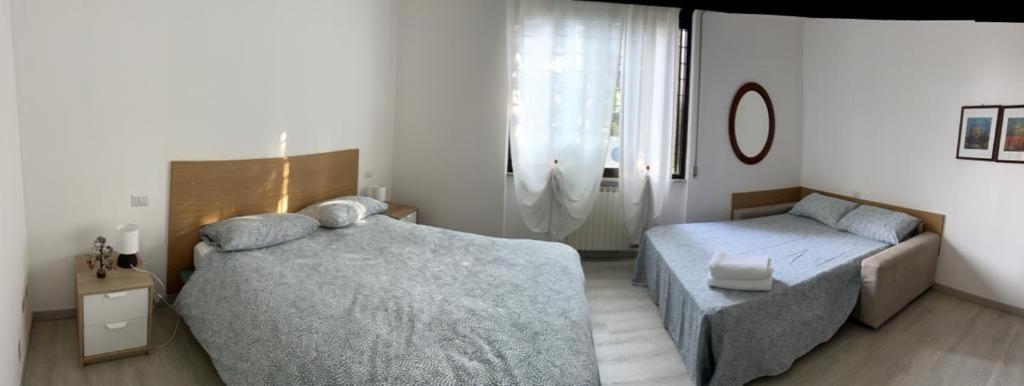 Postel nebo postele na pokoji v ubytování Senza Pensieri via Viviani