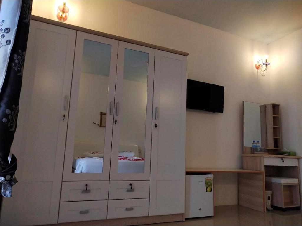 TV a/nebo společenská místnost v ubytování Saima Inn