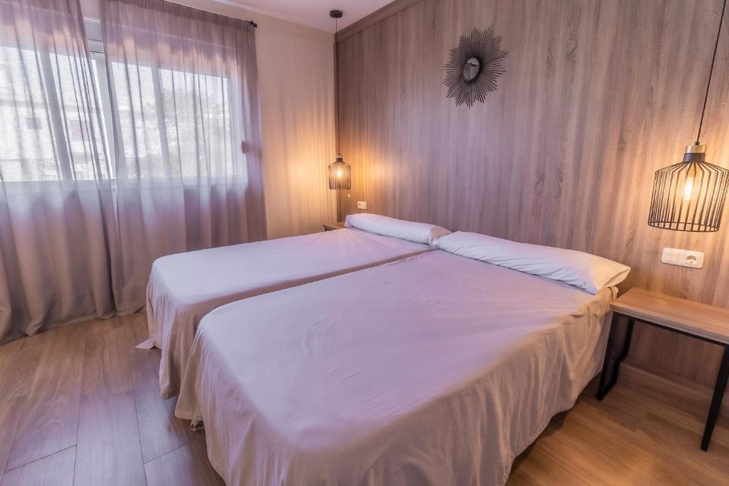 Posteľ alebo postele v izbe v ubytovaní Hotel Kika