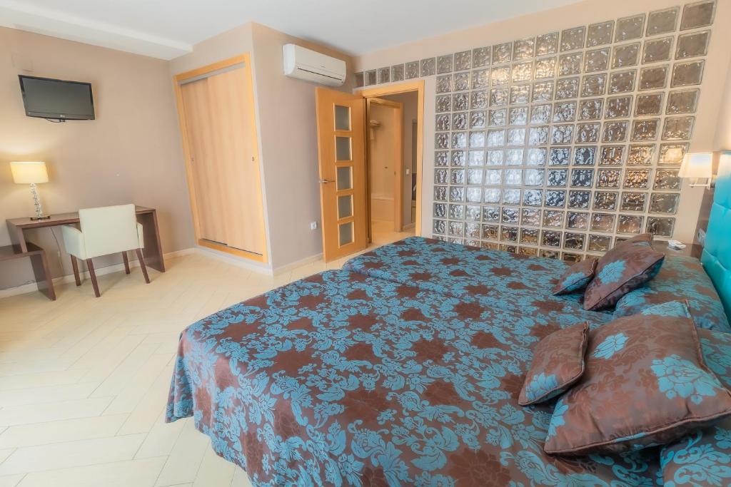 Posteľ alebo postele v izbe v ubytovaní Hotel Kika