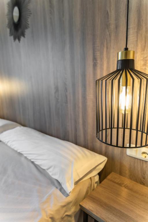 Posteľ alebo postele v izbe v ubytovaní Hotel Kika