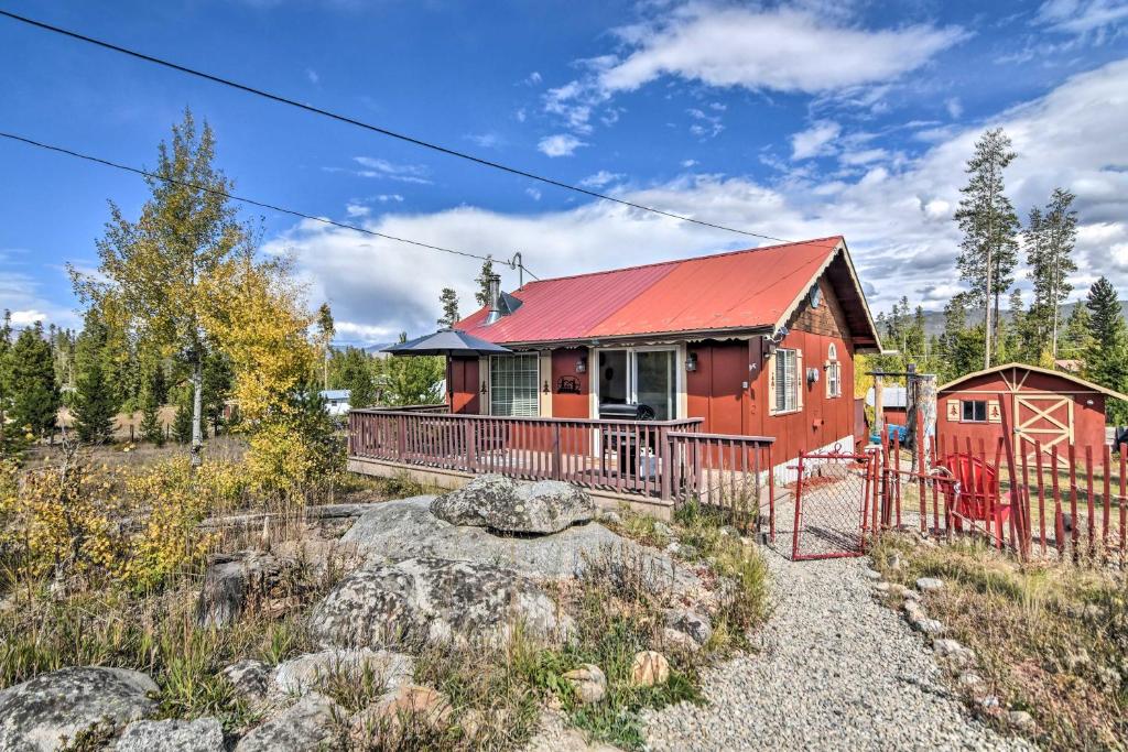 a red house with a red roof at Cozy Cabin with Mountain Views about 4 Mi to Grand Lake! in Grand Lake
