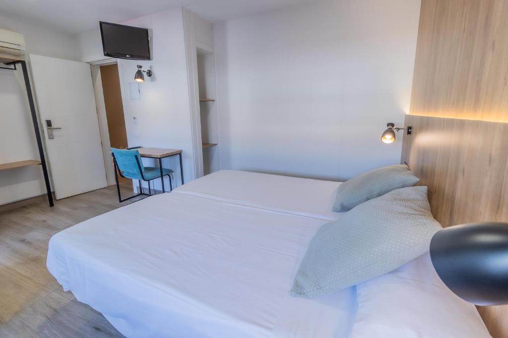 Posteľ alebo postele v izbe v ubytovaní Hotel Kika