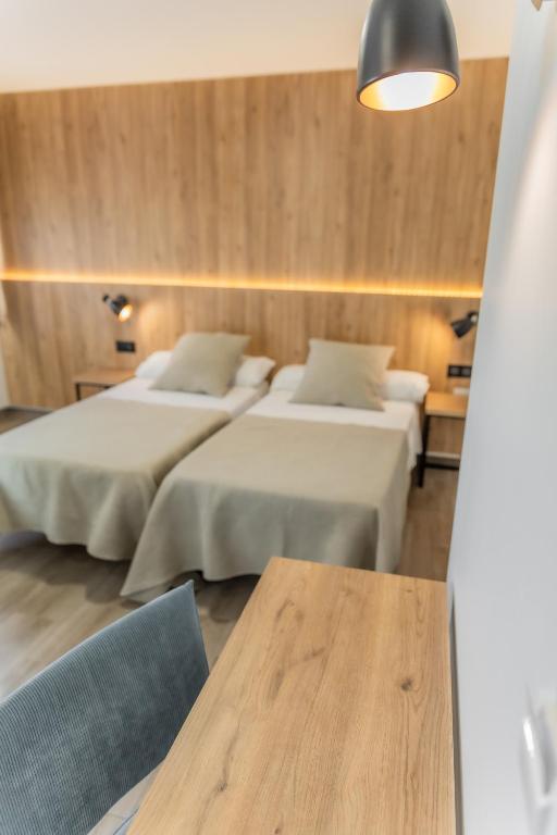 Posteľ alebo postele v izbe v ubytovaní Hotel Kika