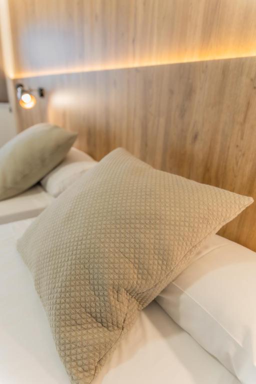 Posteľ alebo postele v izbe v ubytovaní Hotel Kika