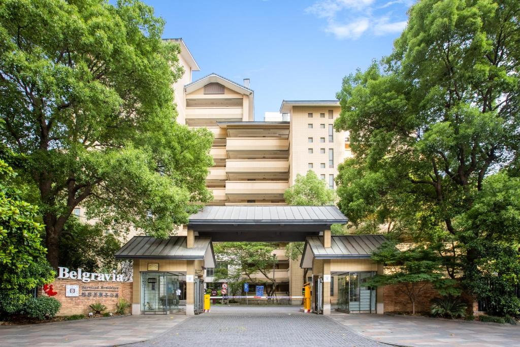 a building with a walkway in front of it at Belgravia Serviced Residence Wuxi in Wuxi