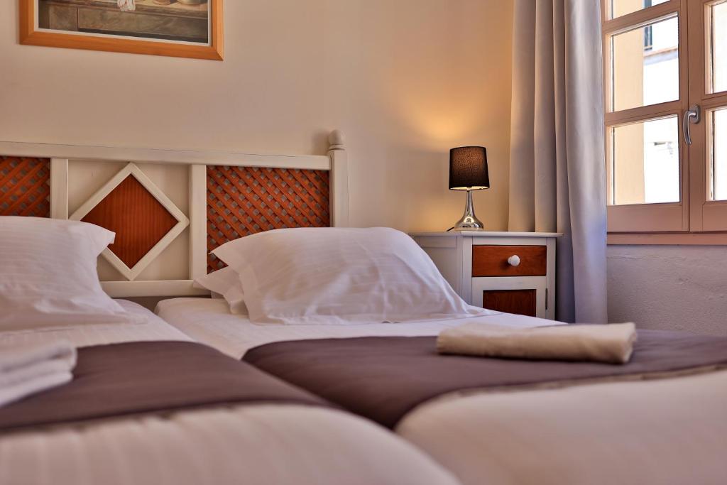 Postel nebo postele na pokoji v ubytování Hôtel Playa