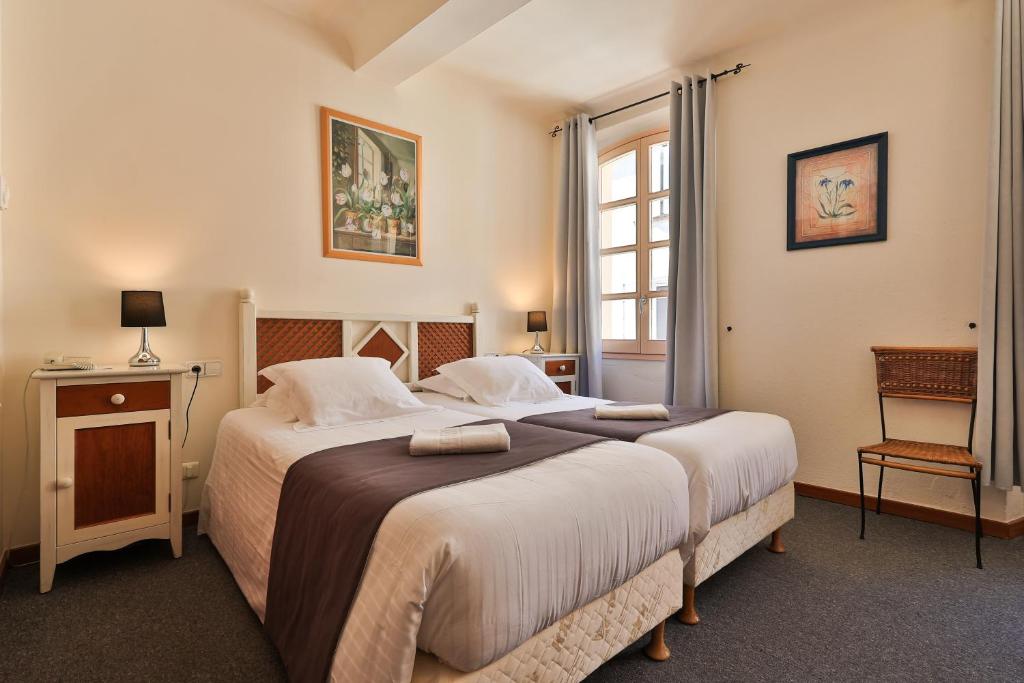 Postel nebo postele na pokoji v ubytování Hôtel Playa