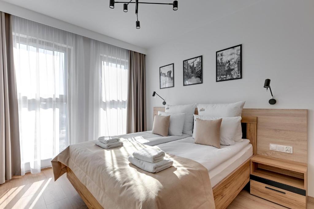 Posteľ alebo postele v izbe v ubytovaní Grano Residence - Pool, Sauna, SPA & Parking by Downtown Apartments