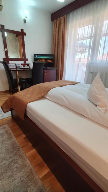 Postel nebo postele na pokoji v ubytování Pensiunea Select