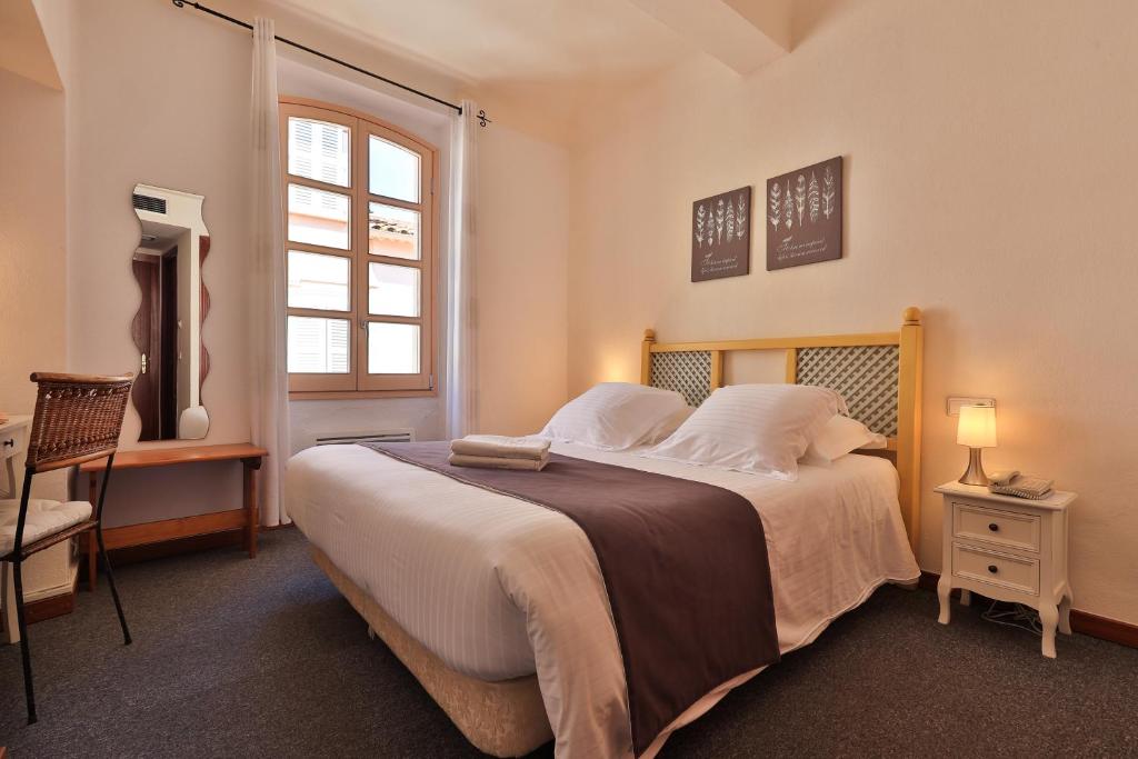 Postel nebo postele na pokoji v ubytování Hôtel Playa