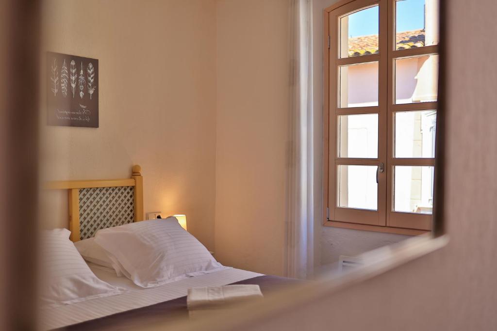 Postel nebo postele na pokoji v ubytování Hôtel Playa
