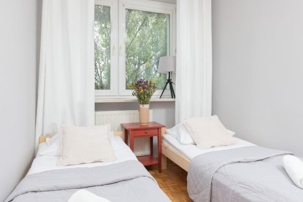 Posteľ alebo postele v izbe v ubytovaní Warsaw Magellana Apartment by Noclegi Renters
