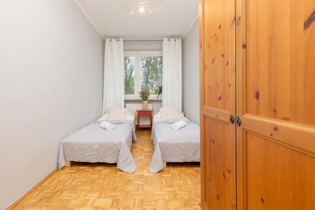 Posteľ alebo postele v izbe v ubytovaní Warsaw Magellana Apartment by Noclegi Renters