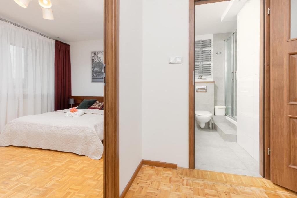 Posteľ alebo postele v izbe v ubytovaní Warsaw Magellana Apartment by Noclegi Renters