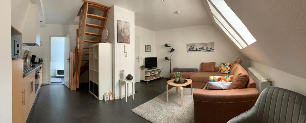 TV a/nebo společenská místnost v ubytování Ferienwohnung Lüttje Hörn