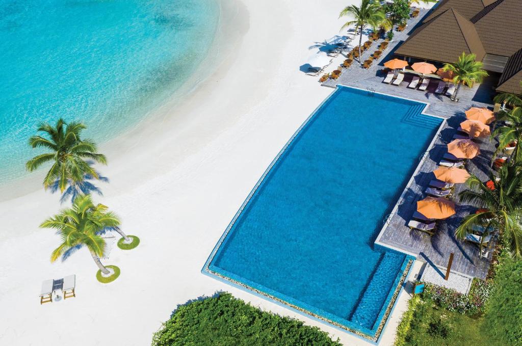 an overhead view of a swimming pool and the beach at VARU by Atmosphere - Premium All Inclusive with Free Transfers in North Male Atoll