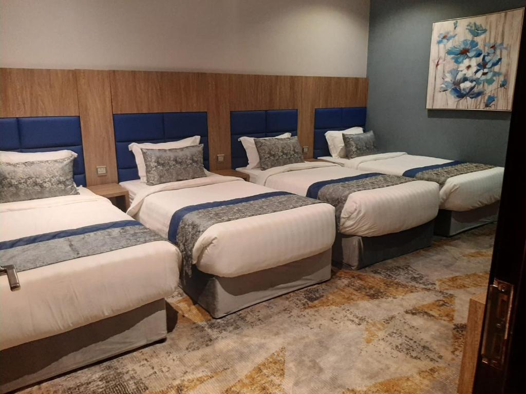 Postel nebo postele na pokoji v ubytování Swat Olaya Hotel Apartments