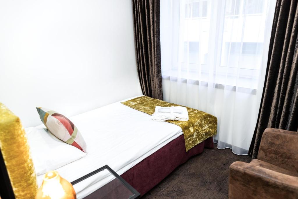 Postel nebo postele na pokoji v ubytování HOF HOTEL