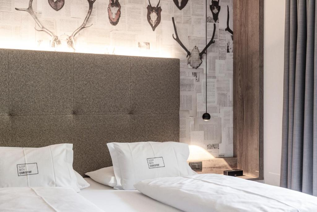 Posteľ alebo postele v izbe v ubytovaní Hotel Christof