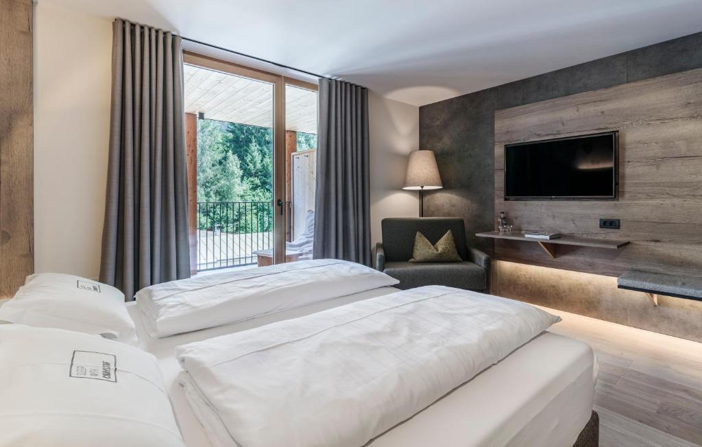 Posteľ alebo postele v izbe v ubytovaní Hotel Christof