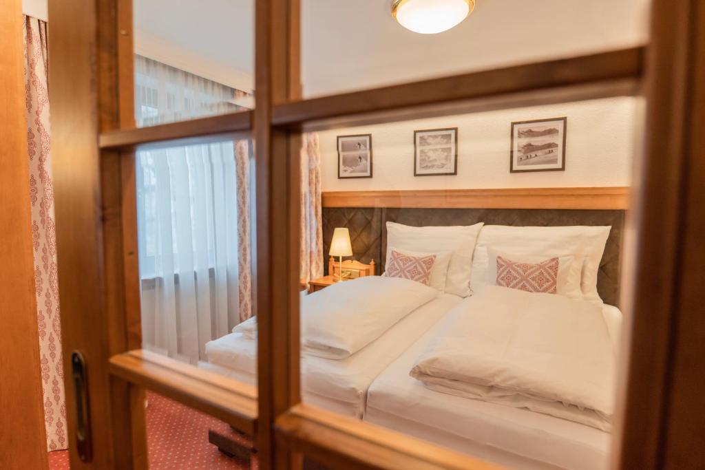 Postel nebo postele na pokoji v ubytování Hotel Ulli