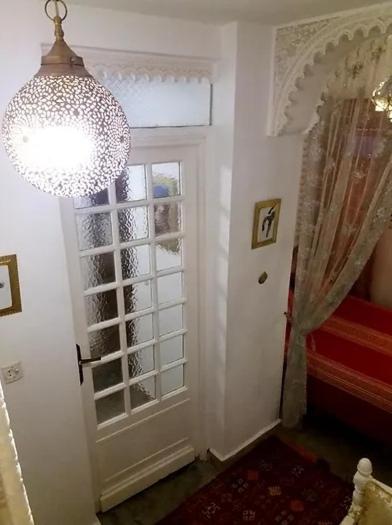 Postel nebo postele na pokoji v ubytování Riad Dar Arsama
