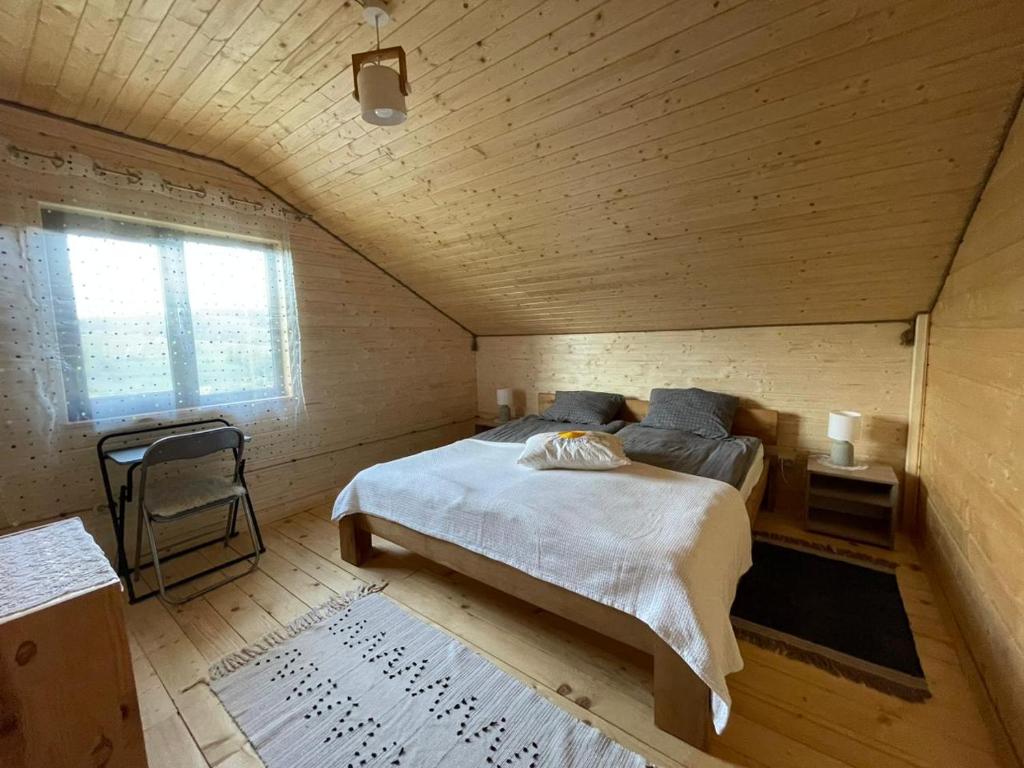 Postel nebo postele na pokoji v ubytování Котедж Gasthof Dresden