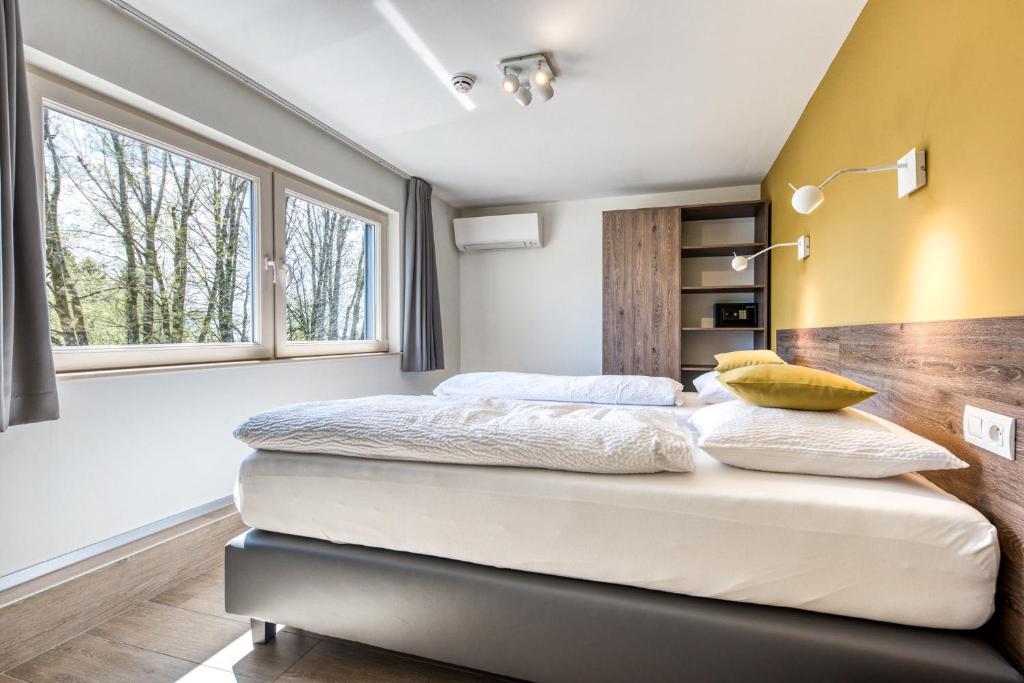 Postel nebo postele na pokoji v ubytování HOTEL L'AVENUE