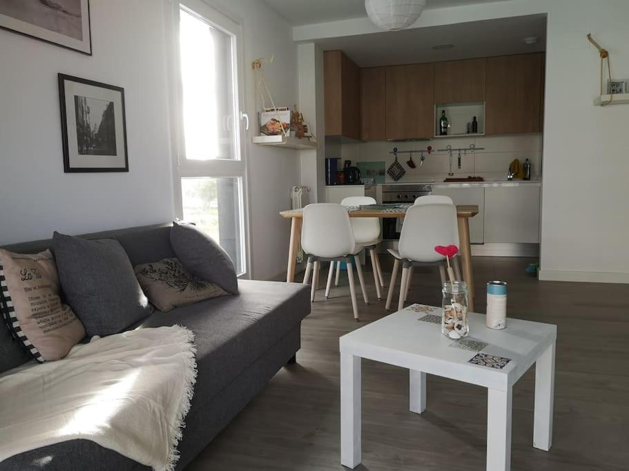 a living room with a couch and a table at Casa de Olga & Jorge in Luanco