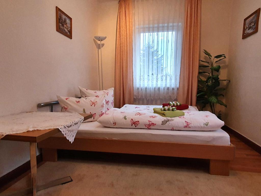 Postel nebo postele na pokoji v ubytování Ferienwohnung Walpurga