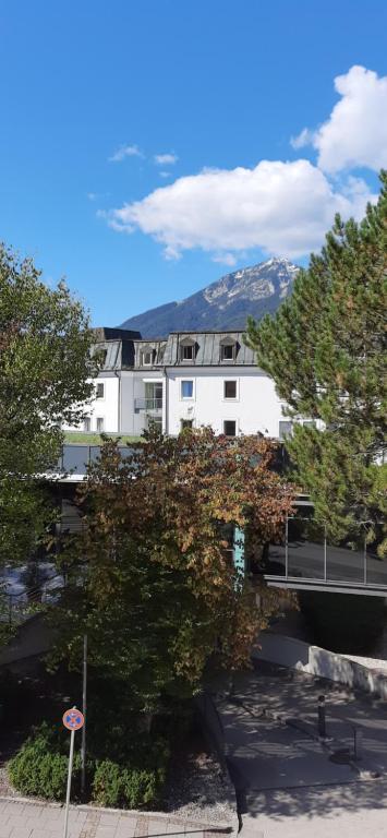 a white building with trees in front of it at Haus Untersberg in Bad Reichenhall