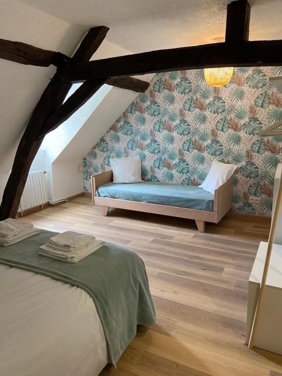 Postel nebo postele na pokoji v ubytování La Charmeraie : gîte de charme, piscine et spa