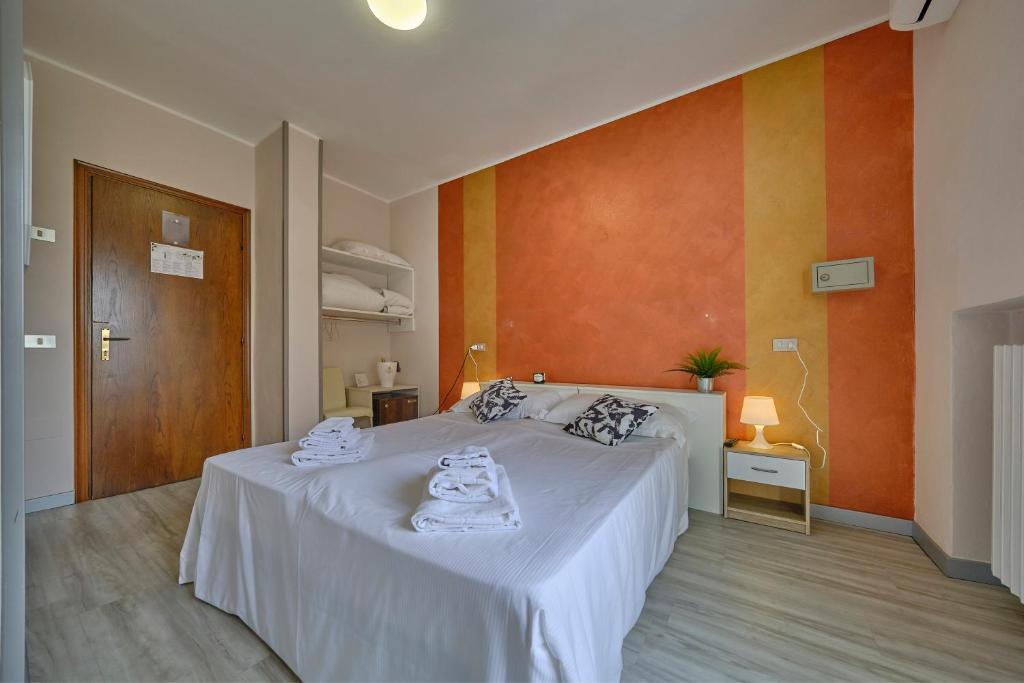 Postel nebo postele na pokoji v ubytování HOTEL VITTORIA