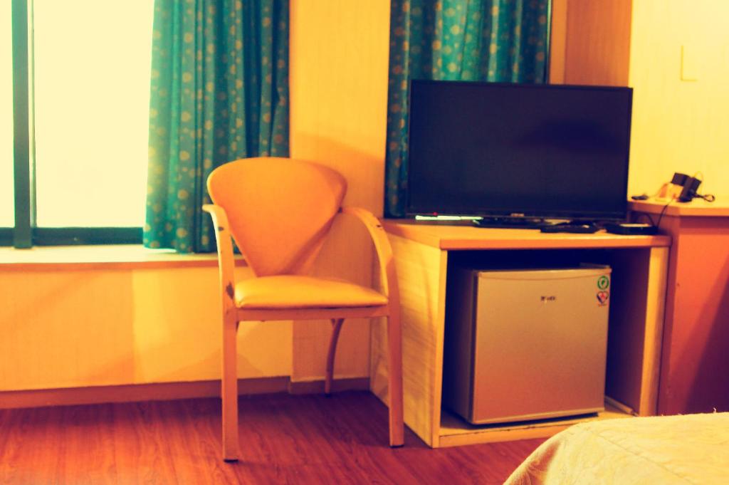 TV a/nebo společenská místnost v ubytování Li Duo Hotel