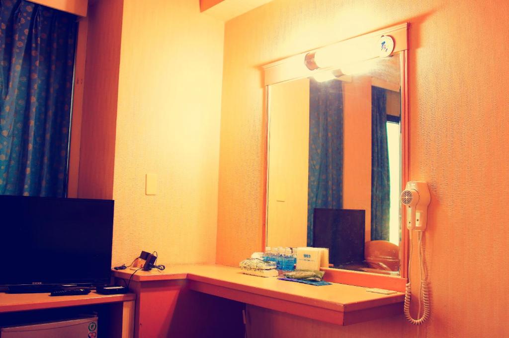 TV a/nebo společenská místnost v ubytování Li Duo Hotel