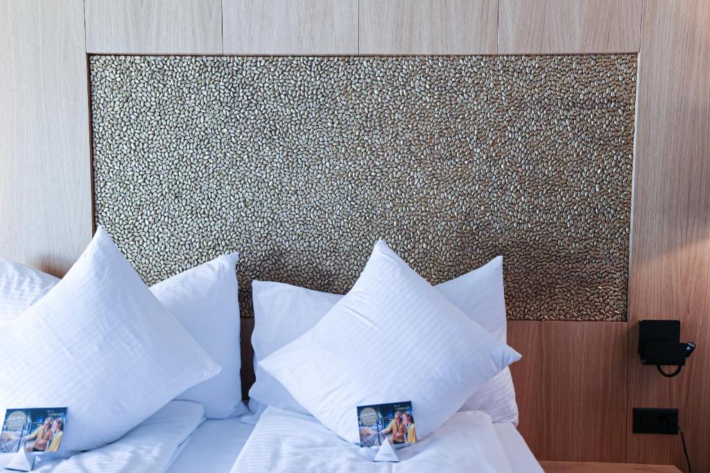 Postel nebo postele na pokoji v ubytování City Hotel Glarnerland