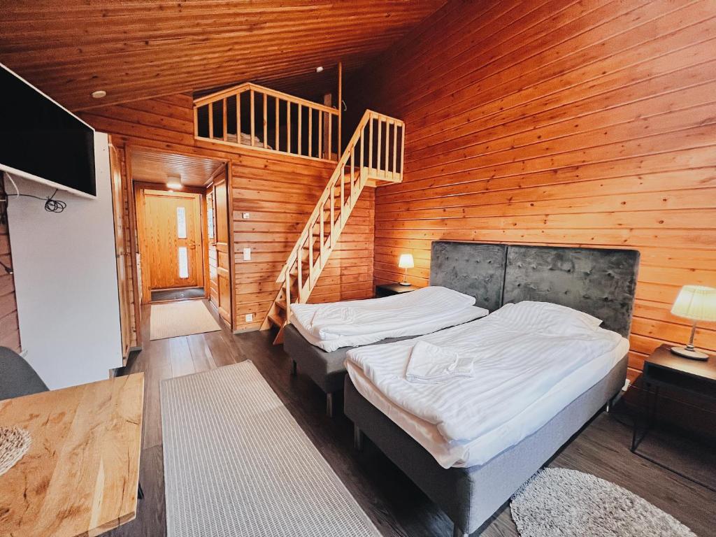 Кровать или кровати в номере Rieskapaikka