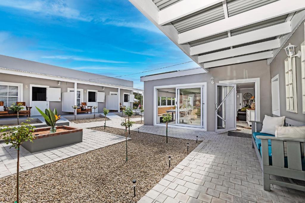 a rendering of a house with a patio at La Montagne Lodge in Riebeek-Kasteel