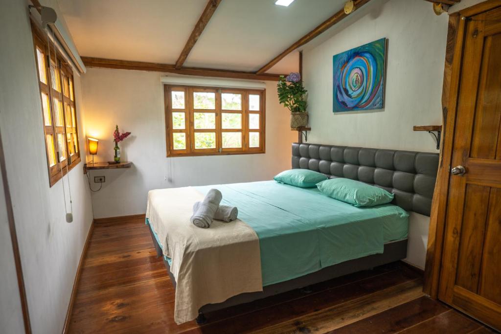 a bedroom with a large bed in a room at Rancho Mila in San Vicente