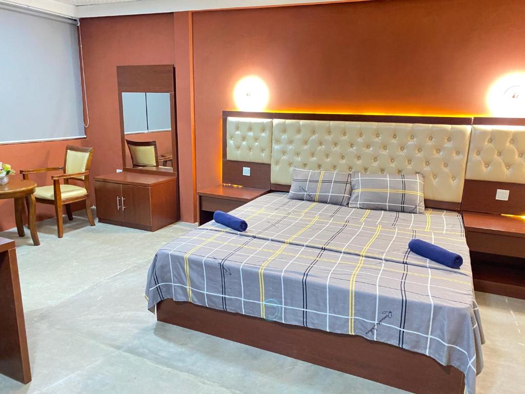 Postel nebo postele na pokoji v ubytování Sundale Hotel