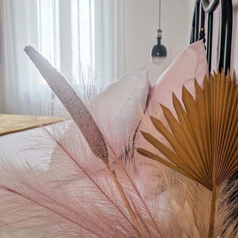 a bunch of feathers sitting on top of a table at Casa Tulù B&B in Bologna