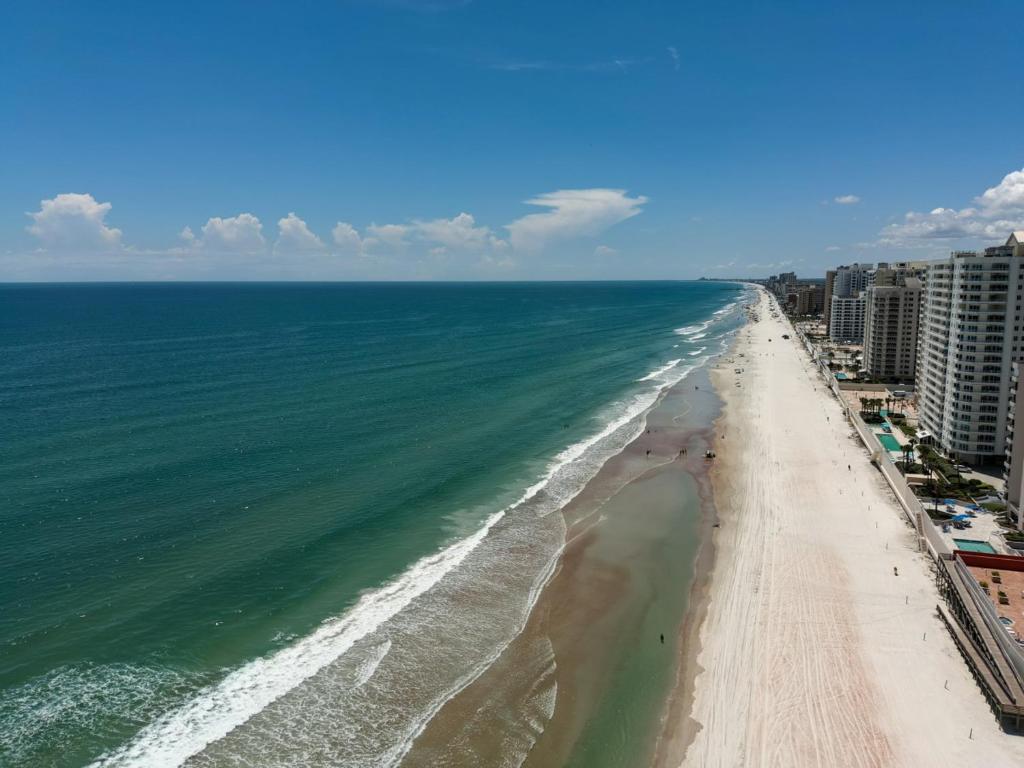 an aerial view of the beach and ocean at Beachfront 4 Bedroom 4 Bath with Huge Deck Wifi in Daytona Beach