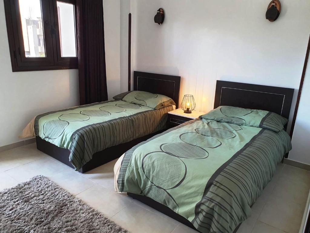 Postel nebo postele na pokoji v ubytování CASA LOKO Guest House