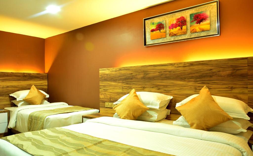 Postel nebo postele na pokoji v ubytování Pearl City Hotel